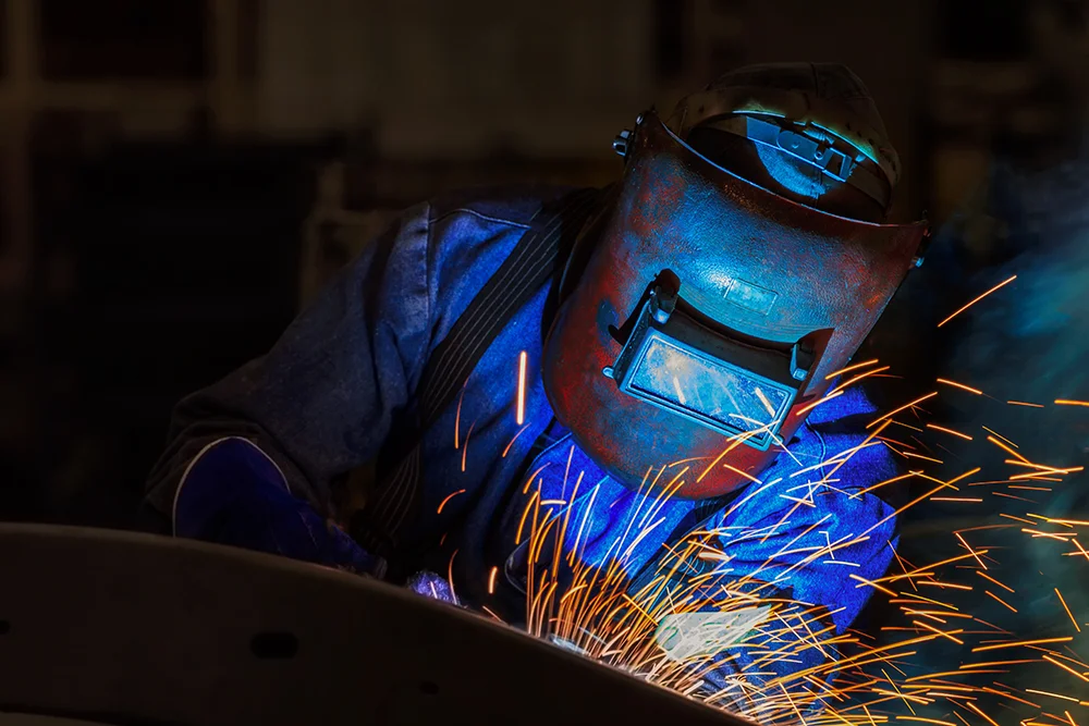 welder with a protective face shield